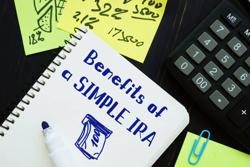 Benefits of a SIMPLE IRA word on notepad on woody desk