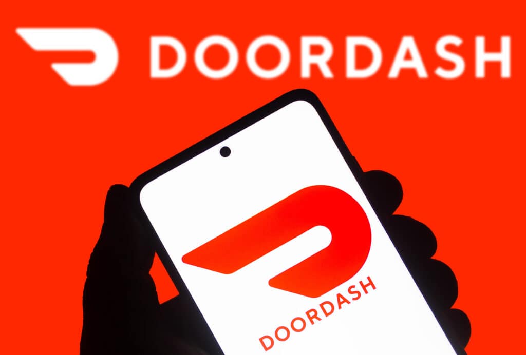 illustration the DoorDash logo seen displayed on a smartphone